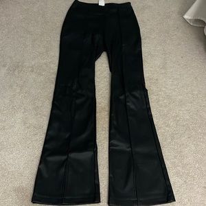 Black leather pants with front slit